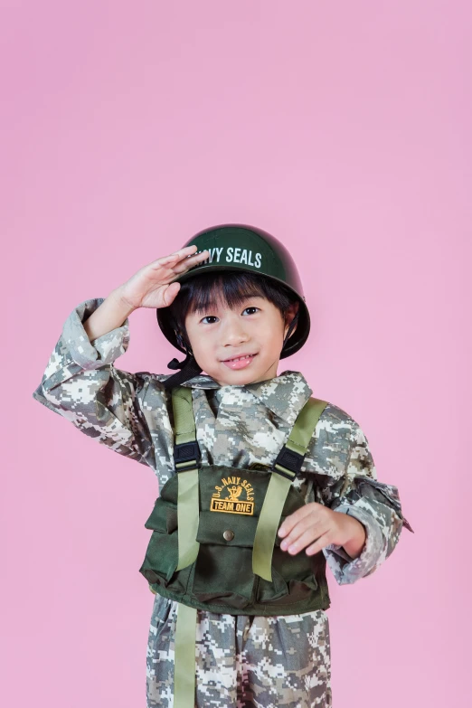 a little boy dressed up as a soldier, an album cover, by Winona Nelson, pexels contest winner, dau-al-set, jaeyeon nam, kids toys, military carrier rig, actress