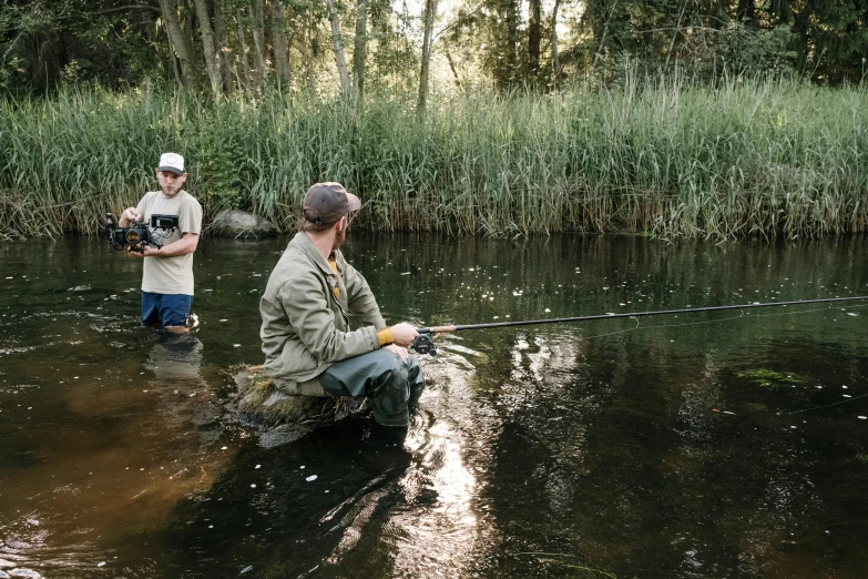 a couple of men fishing in a river, a portrait, unsplash, process art, “ iron bark, full frame image, thumbnail, high-resolution