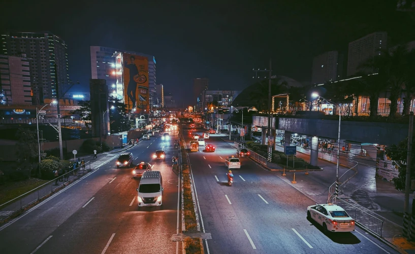 a city street filled with lots of traffic at night, pexels contest winner, hyperrealism, 1970s philippines, empty streetscapes, gif, long distance photo