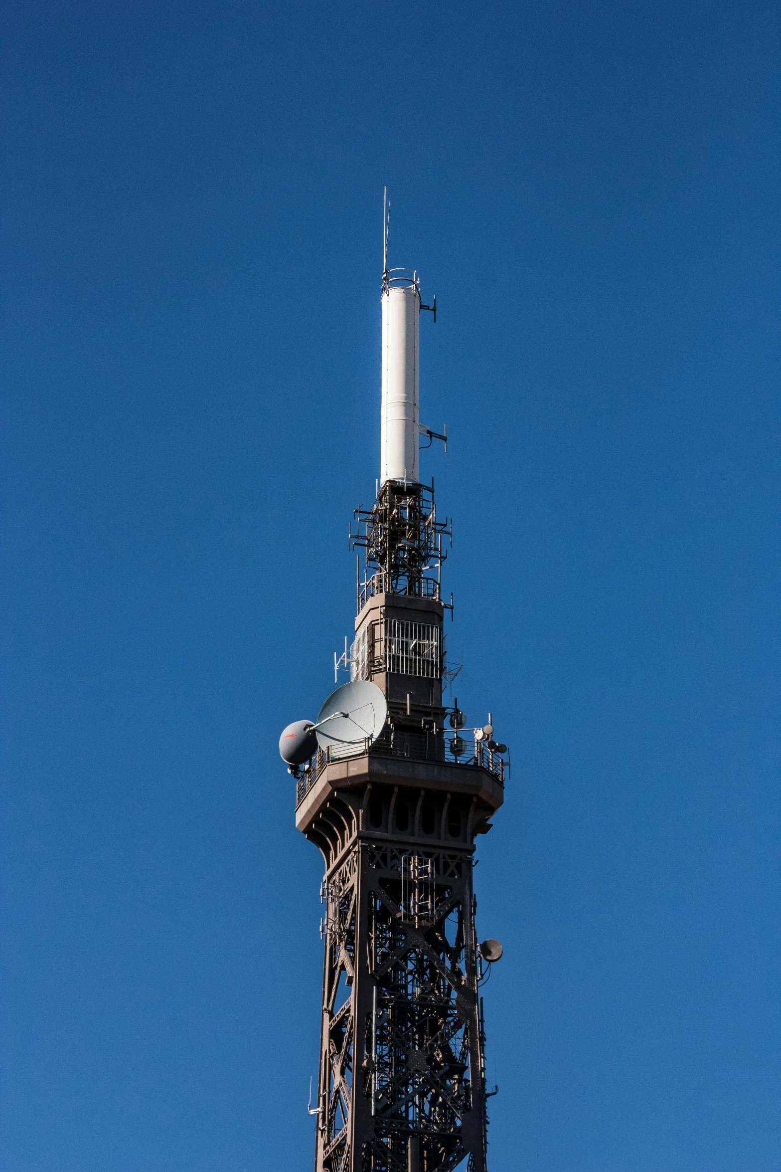 a tall tower with a clock on top of it, antennae, in paris, full device, in 2 0 1 5