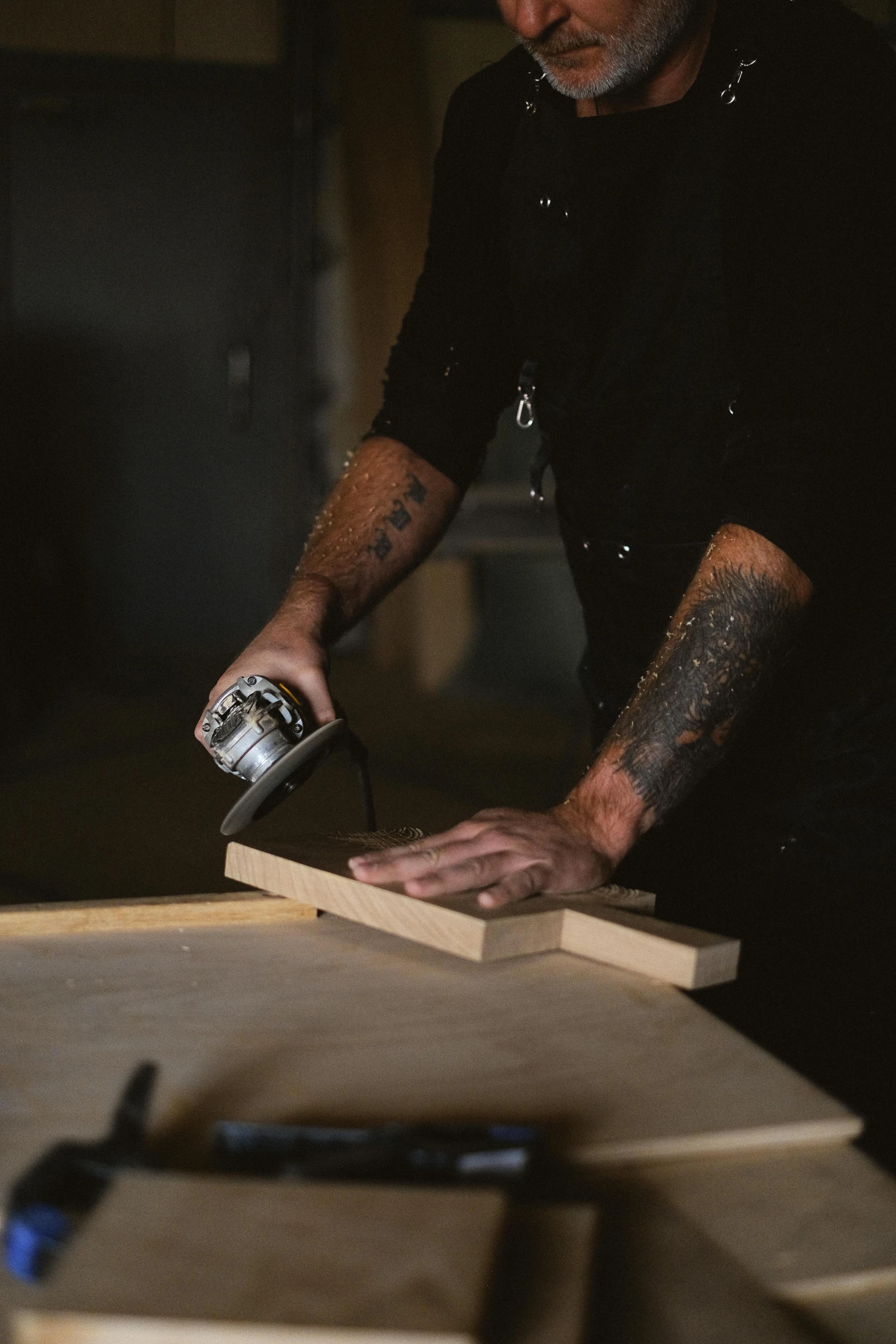 a man is working on a piece of wood, pexels contest winner, arbeitsrat für kunst, manly design, worksafe. instagram photo, video still, sleek hands