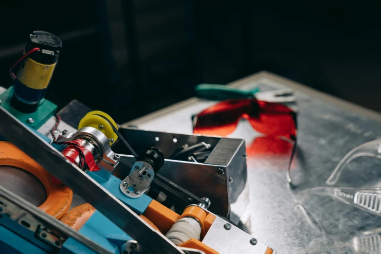 a machine that is sitting on top of a table, pexels contest winner, bauhaus, goggles, screwdrivers, colored lasers, thumbnail