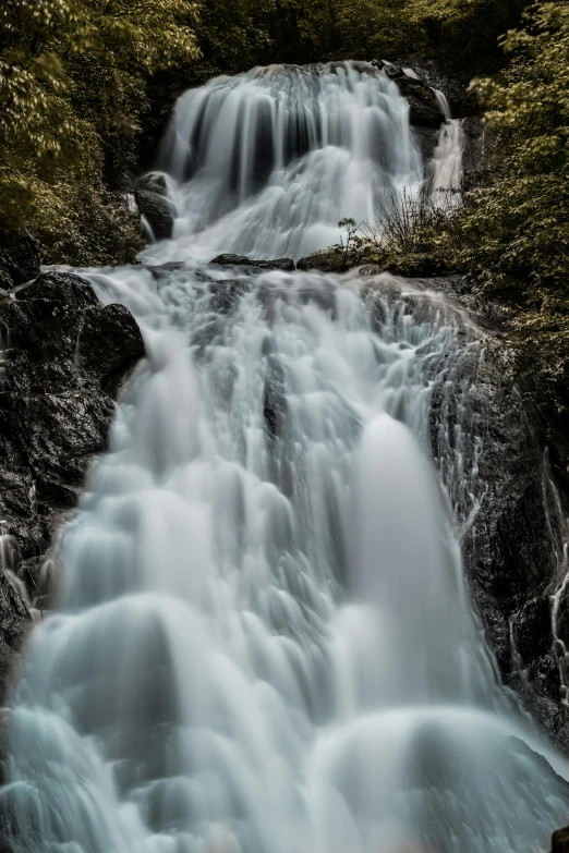 a waterfall in the middle of a forest, photo taken with sony a7r, norway, superb detail 8 k, looking threatening