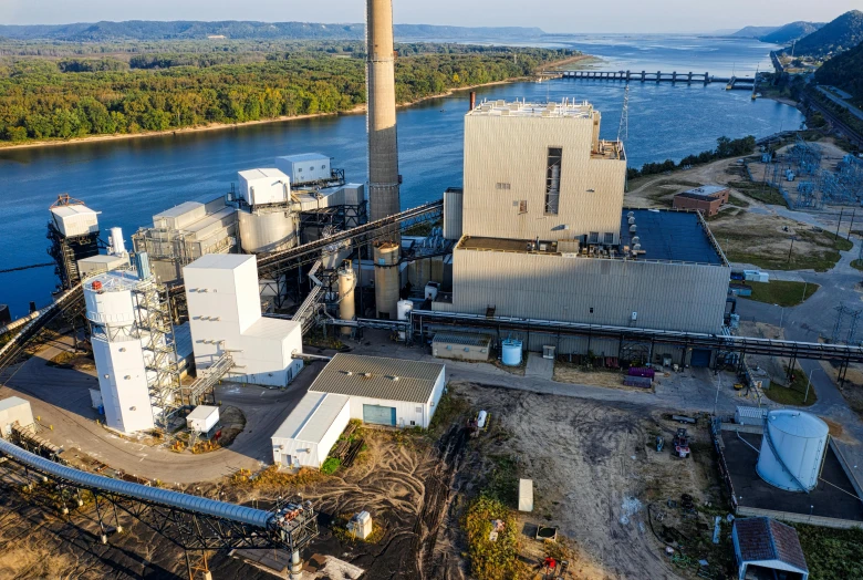 a large factory next to a body of water, a portrait, organic biomass, limestone, thumbnail, fan favorite