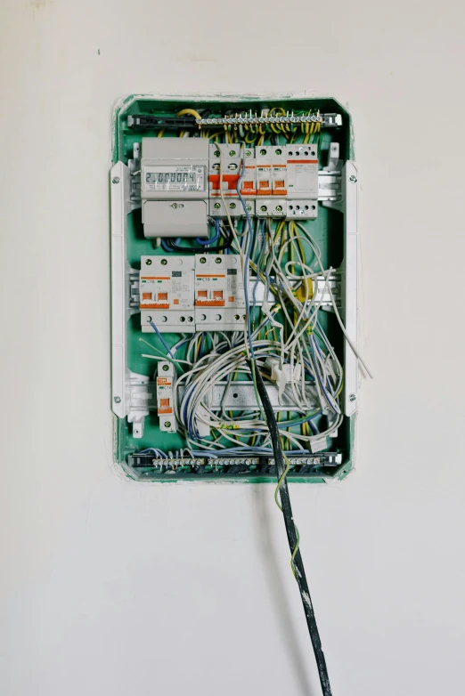 a close up of a wiring board on a wall, by Jan Rustem, unsplash, altermodern, inside its box, ignant, diagnostics, network