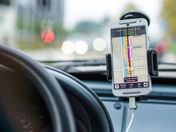 a cell phone attached to the dashboard of a car, by Carey Morris, pixabay, graffiti, square, focus on map, advanced highway, vibrating