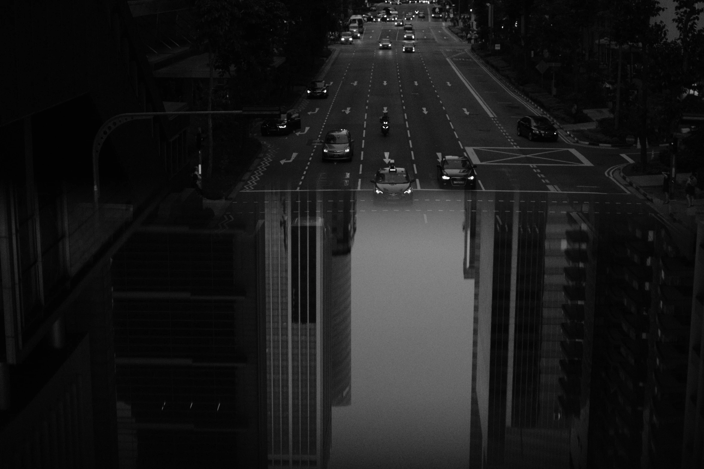 a black and white photo of a city street, by Adam Rex, digital art, detailed reflection, night time footage