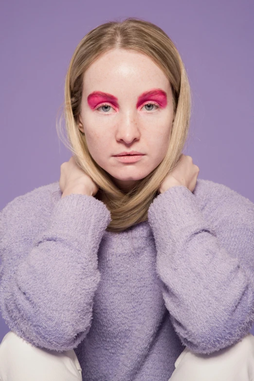 a woman with pink makeup posing for a picture, an album cover, inspired by Maud Naftel, wearing a purple sweatsuit, britt marling style, lily frank, high resolution photo