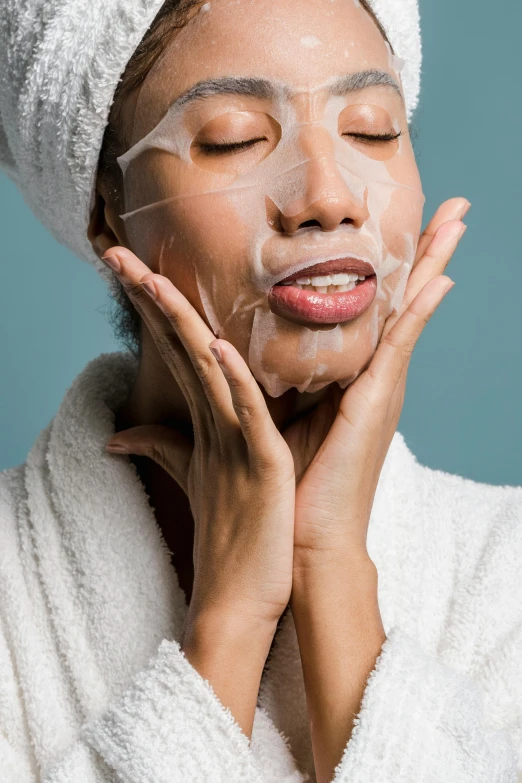 a woman with a towel on her head shaving her face, a portrait, trending on pexels, renaissance, made of lab tissue, manuka, candy treatments, hand on cheek