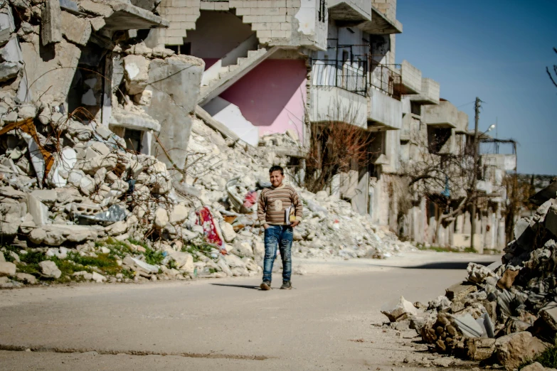 a man walking down a street past a pile of rubble, by Ibrahim Kodra, ruined subdivision houses, 2 0 2 2 photo, joel fletcher, [ cinematic