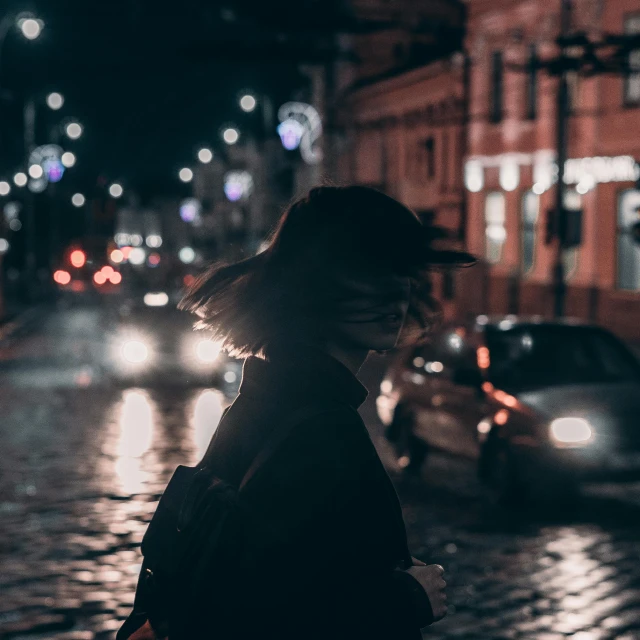 a woman walking down a street at night, pexels contest winner, realism, dark hat, after rain and no girls, instagram post, headlights turned on