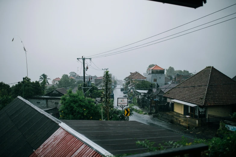 a view of a city from the top of a building, wet road, bali, background image, lena oxton