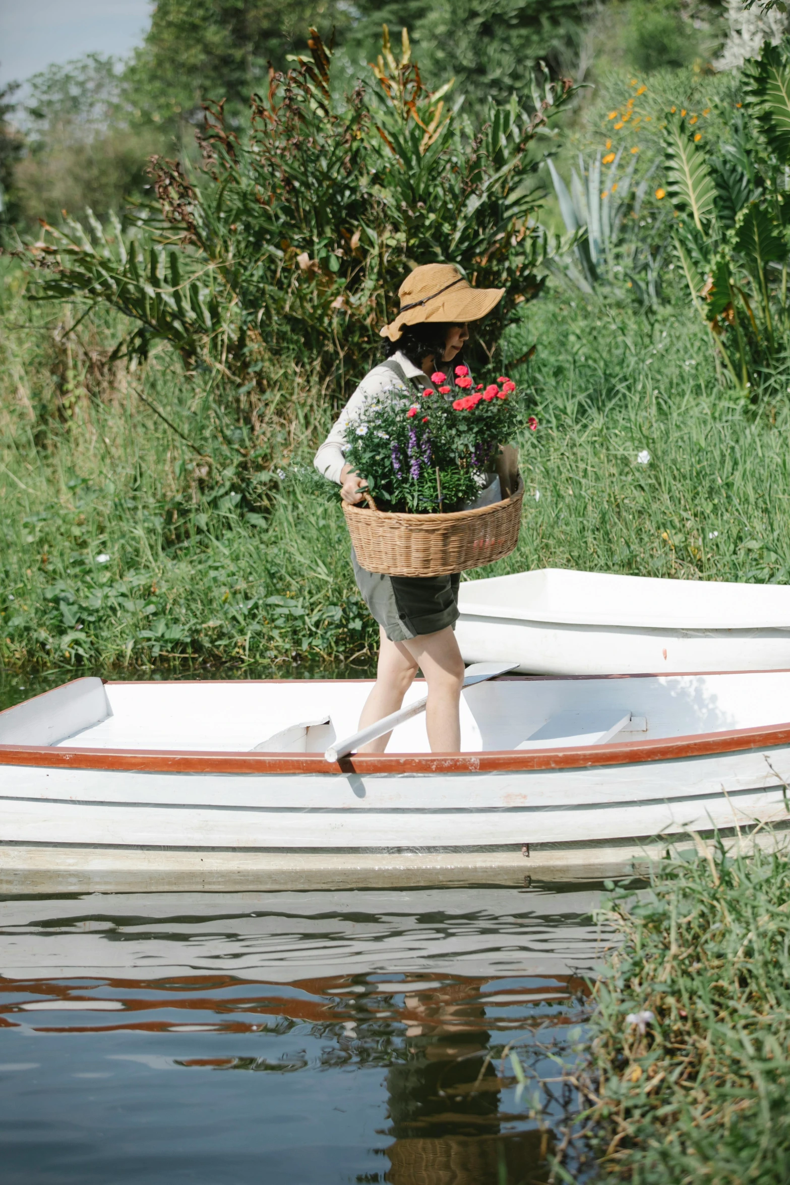 a person in a boat with a basket of flowers, walking down, greenery, pristine and clean, lined in cotton