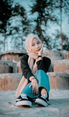 a woman sitting on the ground wearing a hijab, inspired by JoWOnder, unsplash, low quality photo, portrait photo, 15081959 21121991 01012000 4k