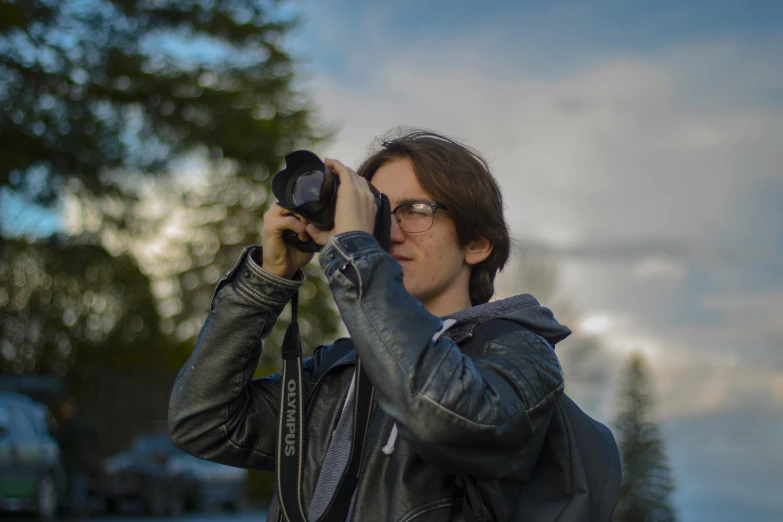 a man taking a picture with a camera, by Ejnar Nielsen, pexels contest winner, photorealism, avatar image, outdoor photo, half - length photo, felix englund