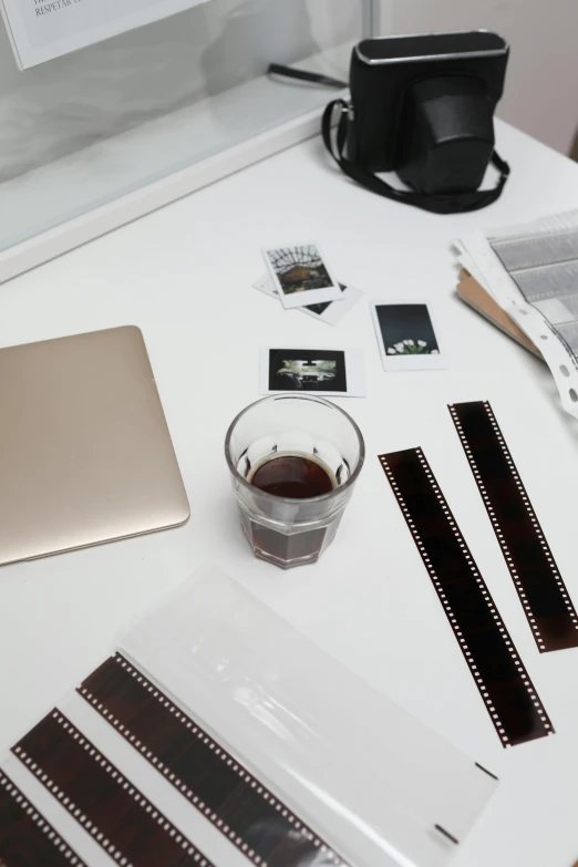 a laptop computer sitting on top of a white desk, inspired by Nan Goldin, pexels contest winner, gelatin silver process, knolling, minimalist sticker, coffee