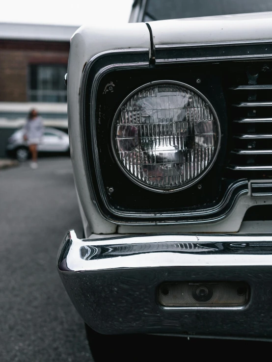 a close up of the front end of a car, by Tom Bonson, pexels contest winner, no lights, on a street, in a hood, greg rutkowski - c 1 0