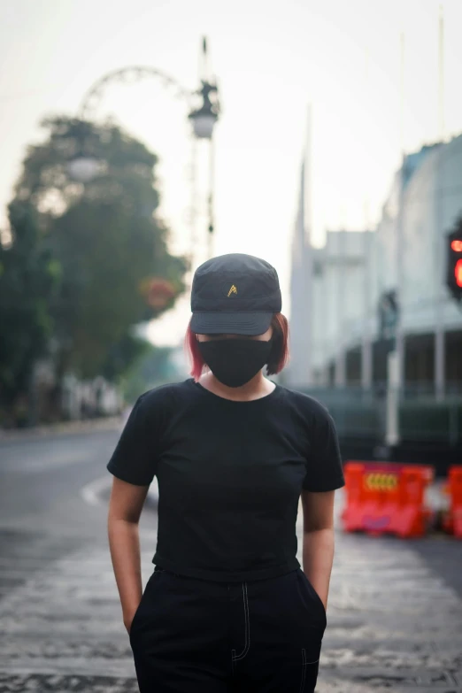 a woman standing in the middle of a street, dark visor covering top of face, jakarta, avatar image, wearing black tshirt