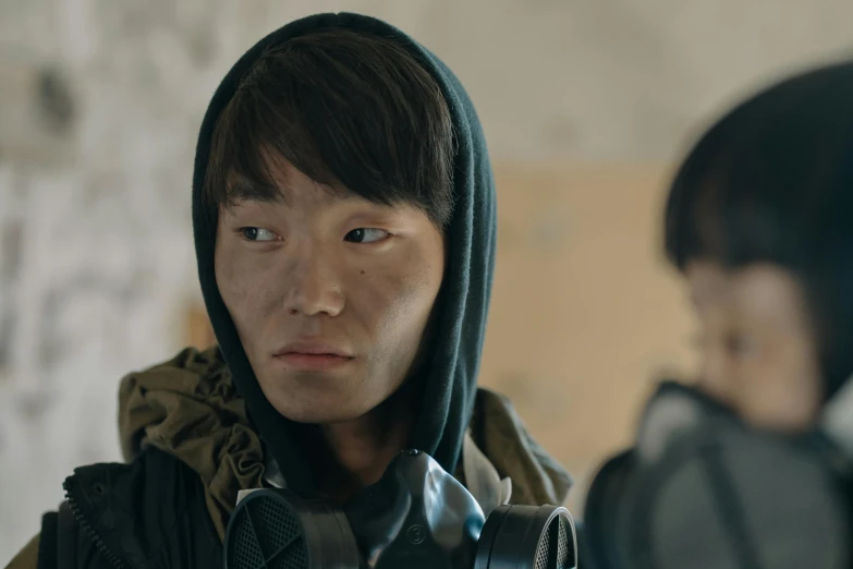 a close up of a person with a camera, by Jang Seung-eop, two characters, dressed in tactical armor, indie film, 1 7 - year - old boy thin face