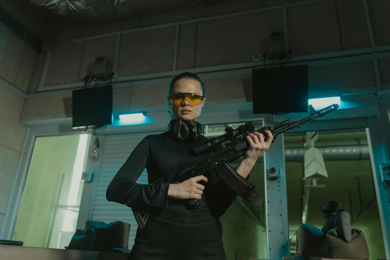 a woman holding a gun in a room, wearing shiny black goggles, game ready, rifle, optics