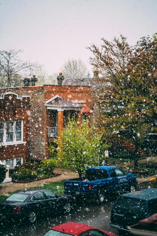 a bunch of cars that are parked in the street, a photo, unsplash contest winner, american barbizon school, falling snow, neighborhood outside window, during spring, washington dc