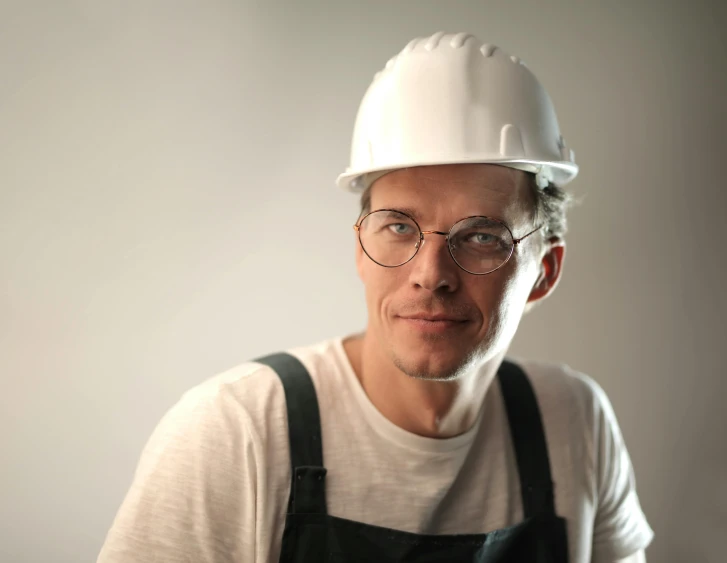 a man wearing a hard hat and glasses, a character portrait, pexels contest winner, arbeitsrat für kunst, white wearing, julian ope, a handsome, well built