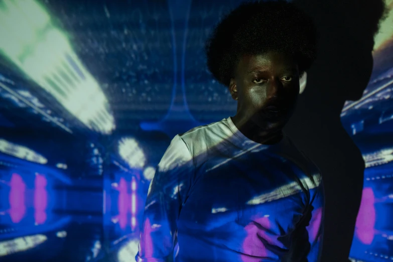 a man that is standing in front of a wall, a hologram, pexels contest winner, afrofuturism, portrait soft low light, teamlab, black man with afro hair, dramatic white and blue lighting