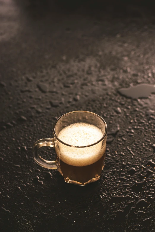 a glass of beer sitting on top of a table, a still life, unsplash, photorealism, dark wet road, hot coffee, vanilla, multiple stories