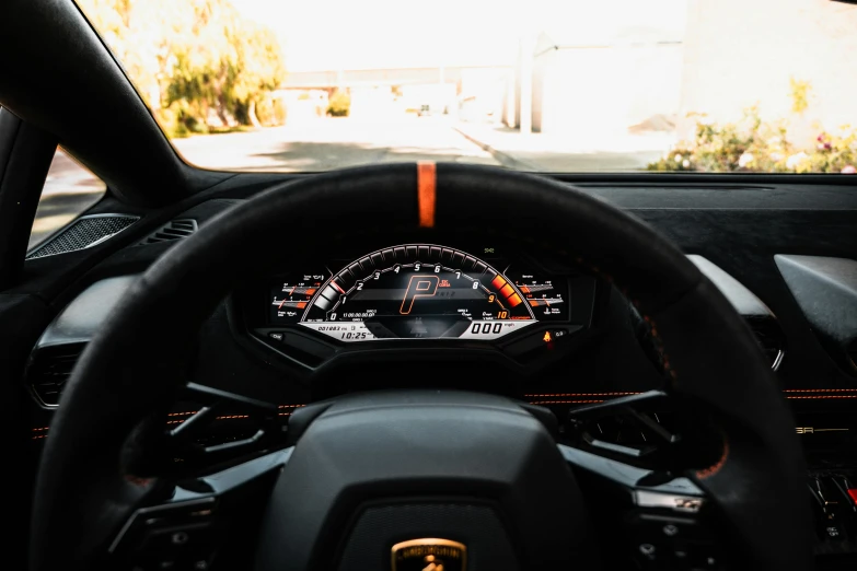 a close up of a steering wheel in a car, bold lamborghini style, thumbnail, orange halo, profile image