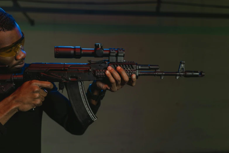 a man in a black shirt holding a rifle, trending on polycount, photorealism, colorful airsoft gun, shot on anamorphic lenses, ak 1 2, cinematic red lighting