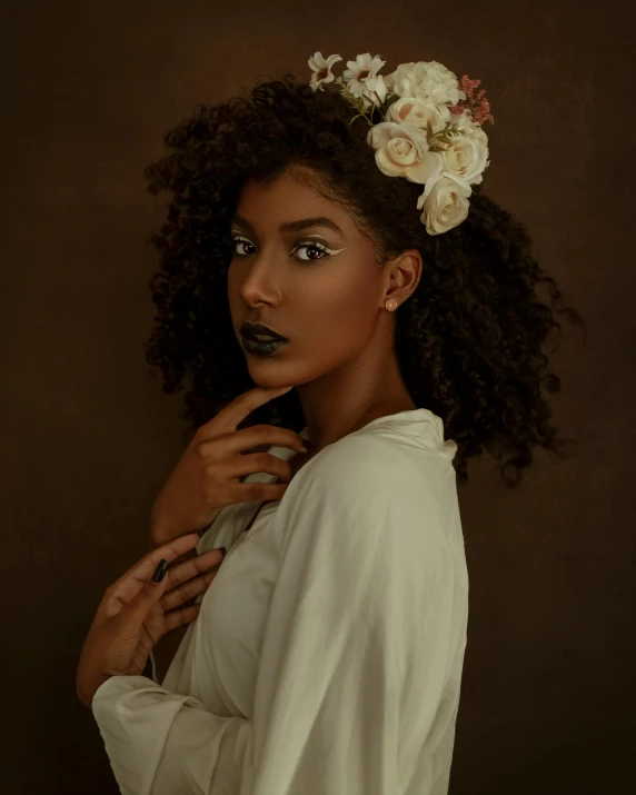 a woman with a flower in her hair, by Lily Delissa Joseph, trending on unsplash, afrofuturism, model posing, dark sienna and white, brown curly hair, at a fashion shoot