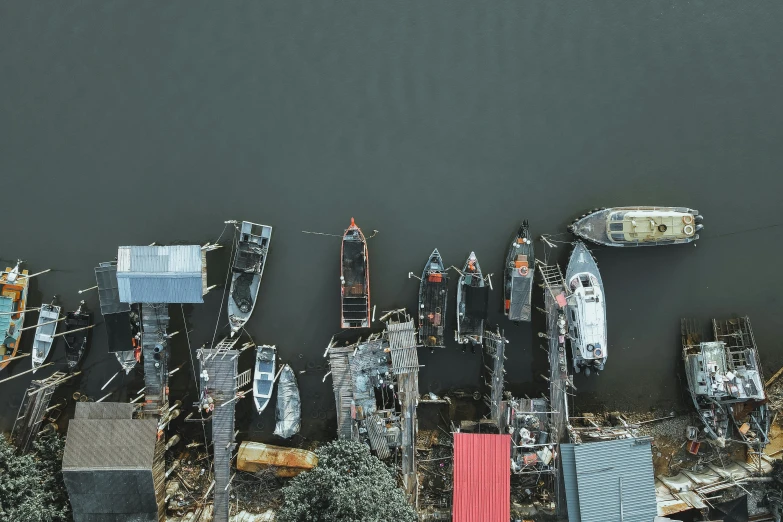 a number of boats in a body of water, by Basuki Abdullah, pexels contest winner, shanty townships, flatlay, grey, upscaled to high resolution