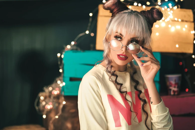 a woman holding a pair of glasses to her eye, a photo, inspired by Elsa Bleda, trending on pexels, maximalism, kawaii hairstyle, wearing festive clothing, nixie tube, wearing casual sweater