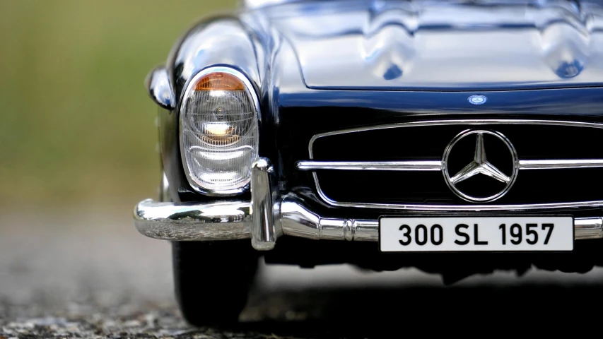 a close up of a toy car on a road, by David Donaldson, pexels contest winner, photorealism, mercedes, close up bust shot, replica model, extremely high detail!!