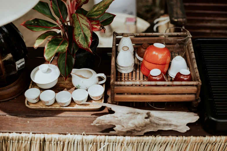 a coffee maker sitting on top of a wooden table, in style of lam manh, picnic, teapots, thumbnail