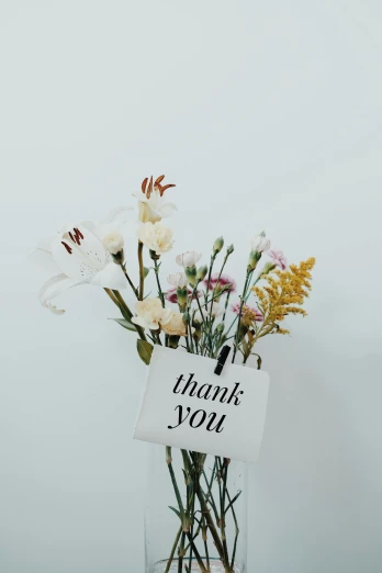 a vase that has some flowers in it, a polaroid photo, trending on unsplash, thank you, white, message, large tall