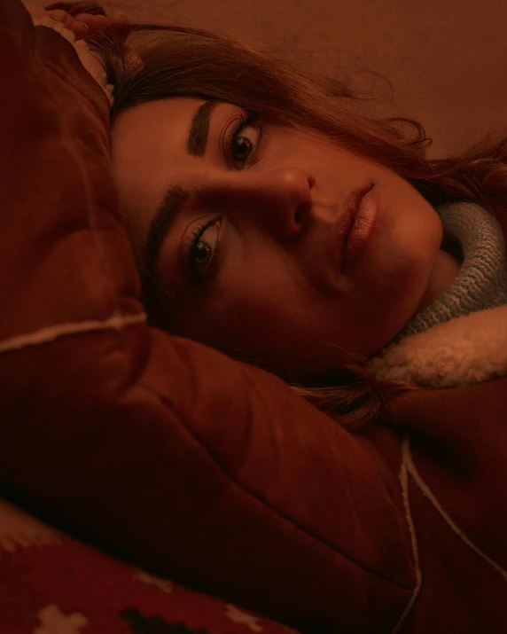 a close up of a person laying on a bed, inspired by Elsa Bleda, happening, looking serious, lgbtq, perfectly lit. movie still, taken in 2 0 2 0