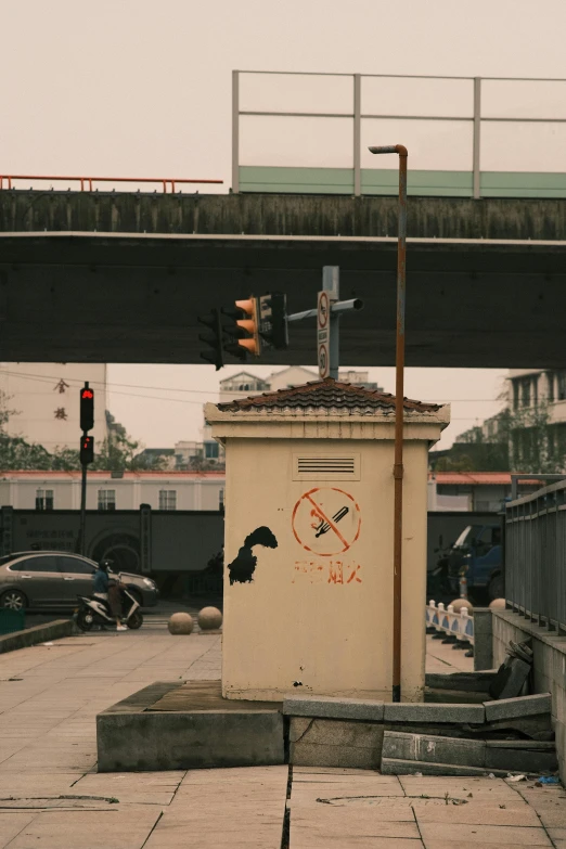a traffic light sitting on the side of a road, by Gang Hui-an, graffiti, no smoke, monorail station, low quality photo, [ cinematic