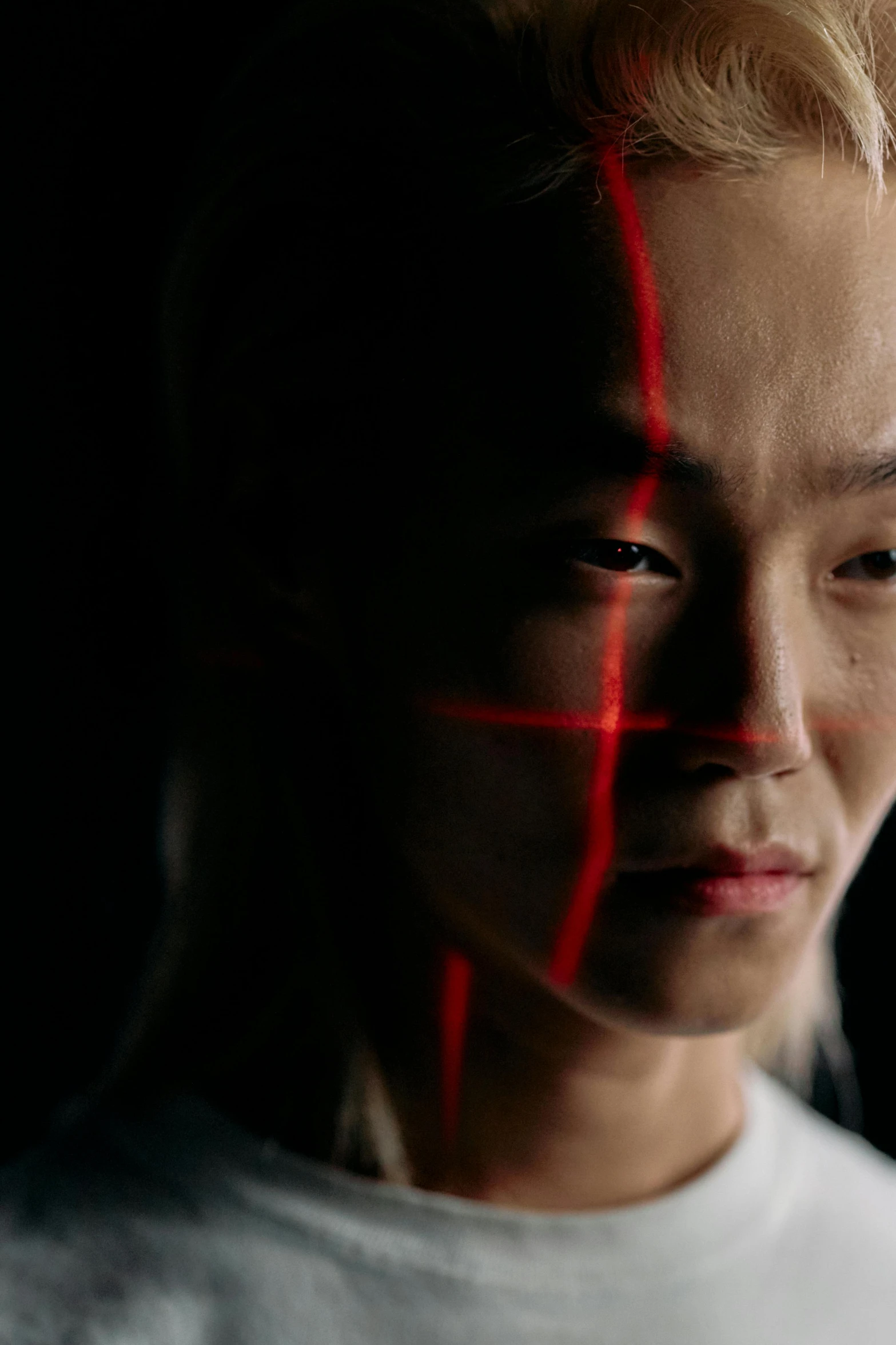 a close up of a person with red lines on their face, a picture, inspired by Zhu Da, pexels contest winner, justin sun, light from right, ryoji, looking serious