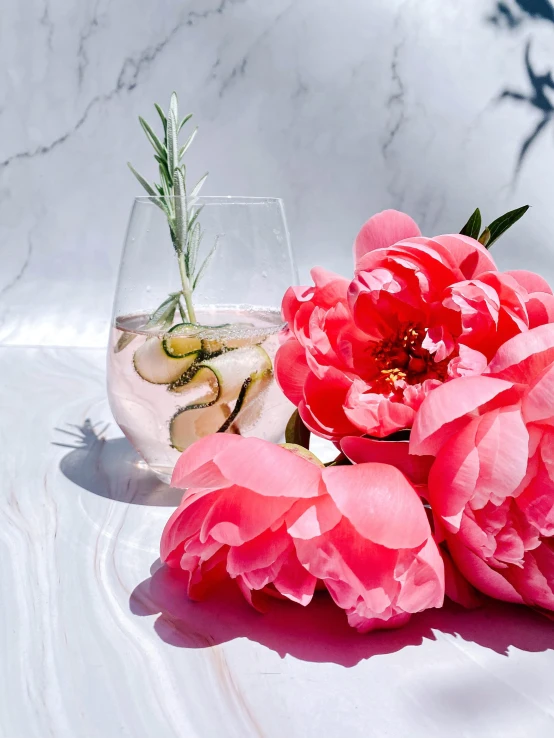 a vase filled with pink flowers sitting on top of a table, inspired by Ndoc Martini, while marble, summer vibe, highly polished, bio-inspired