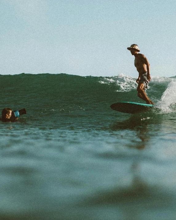 a man riding a wave on top of a surfboard, a polaroid photo, unsplash contest winner, renaissance, mexican standoff, thumbnail, two male, non-binary