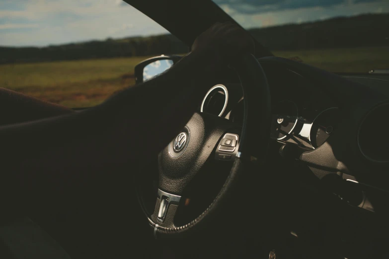 a close up of a steering wheel in a car, pexels contest winner, touareg, convertible, avatar image, thumbnail