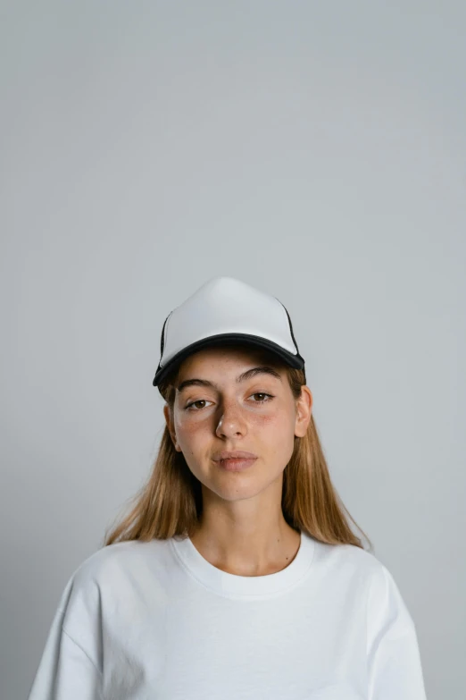 a woman wearing a white t - shirt and a black hat, by Leo Leuppi, unsplash contest winner, wearing baseball cap, on clear background, facing front, 16k resolution:0.6|people