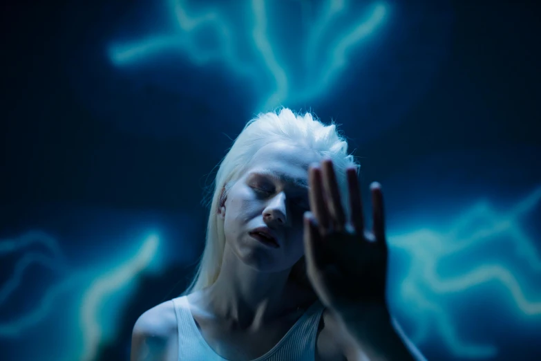 a woman standing in front of a blue light, a hologram, inspired by Elsa Bleda, pexels contest winner, intense albino, with thunderstorms, die antwoord yolandi visser, hands reaching for her