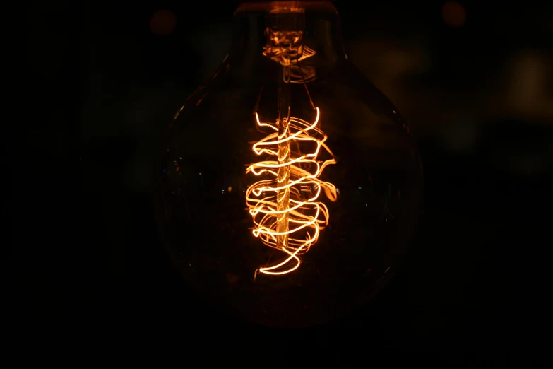 a light bulb that is glowing in the dark, a picture, by Adam Marczyński, pexels contest winner, cyber copper spiral decorations, light tan, tendrils, brown