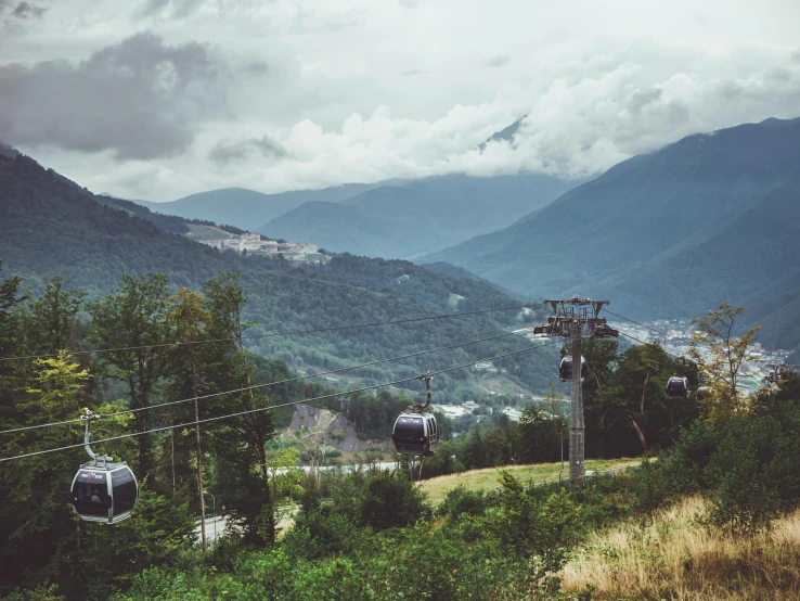 a cable car sitting on top of a lush green hillside, by Tobias Stimmer, pexels contest winner, renaissance, whistler, avatar image