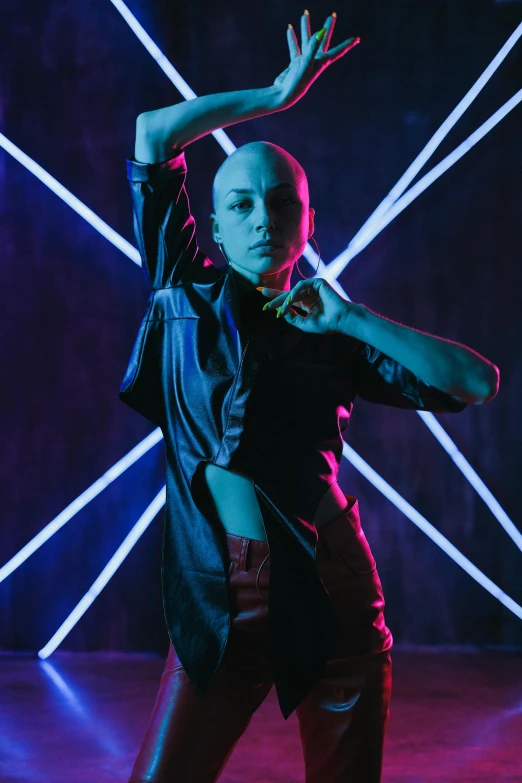 a woman dancing with neon lights in the background, an album cover, pexels contest winner, antipodeans, shaved bald head, leather clothing, dasha taran, doja cat