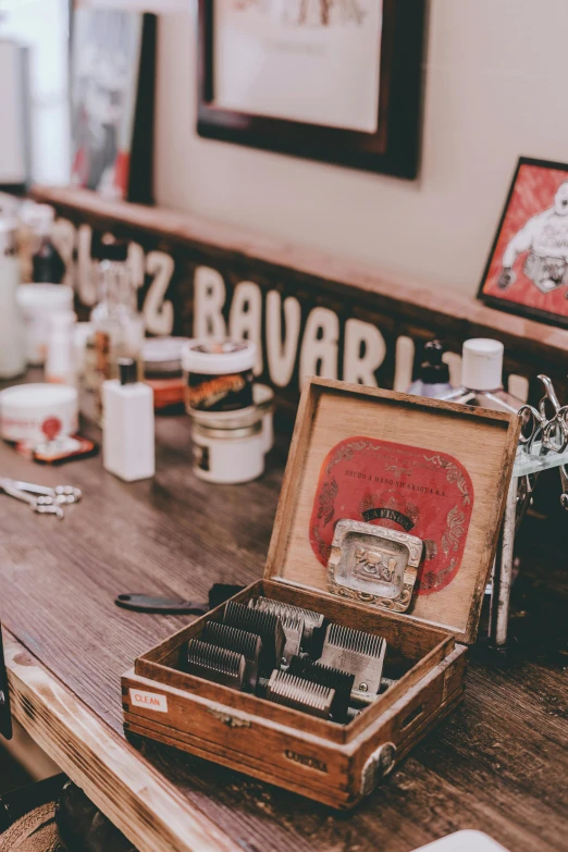 a man getting his hair cut at a barber shop, an album cover, pexels contest winner, cigarrette boxes at the table, cafe racer, tools, hazy