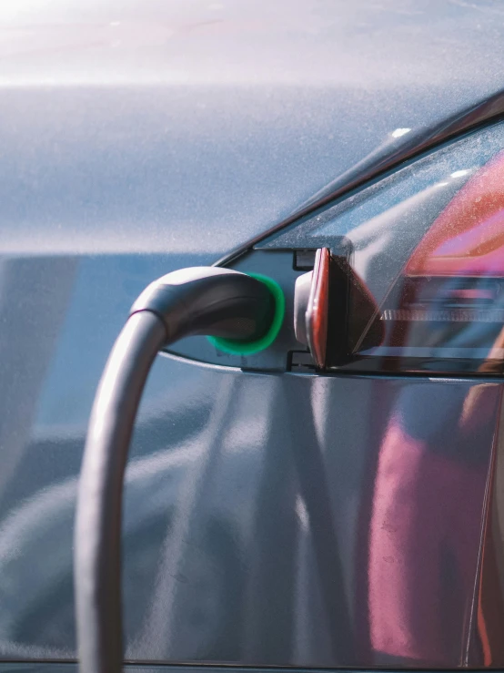 a close up of a car with an electric charger, trending on pexels, happening, square, full frame image, thumbnail, high quality photo