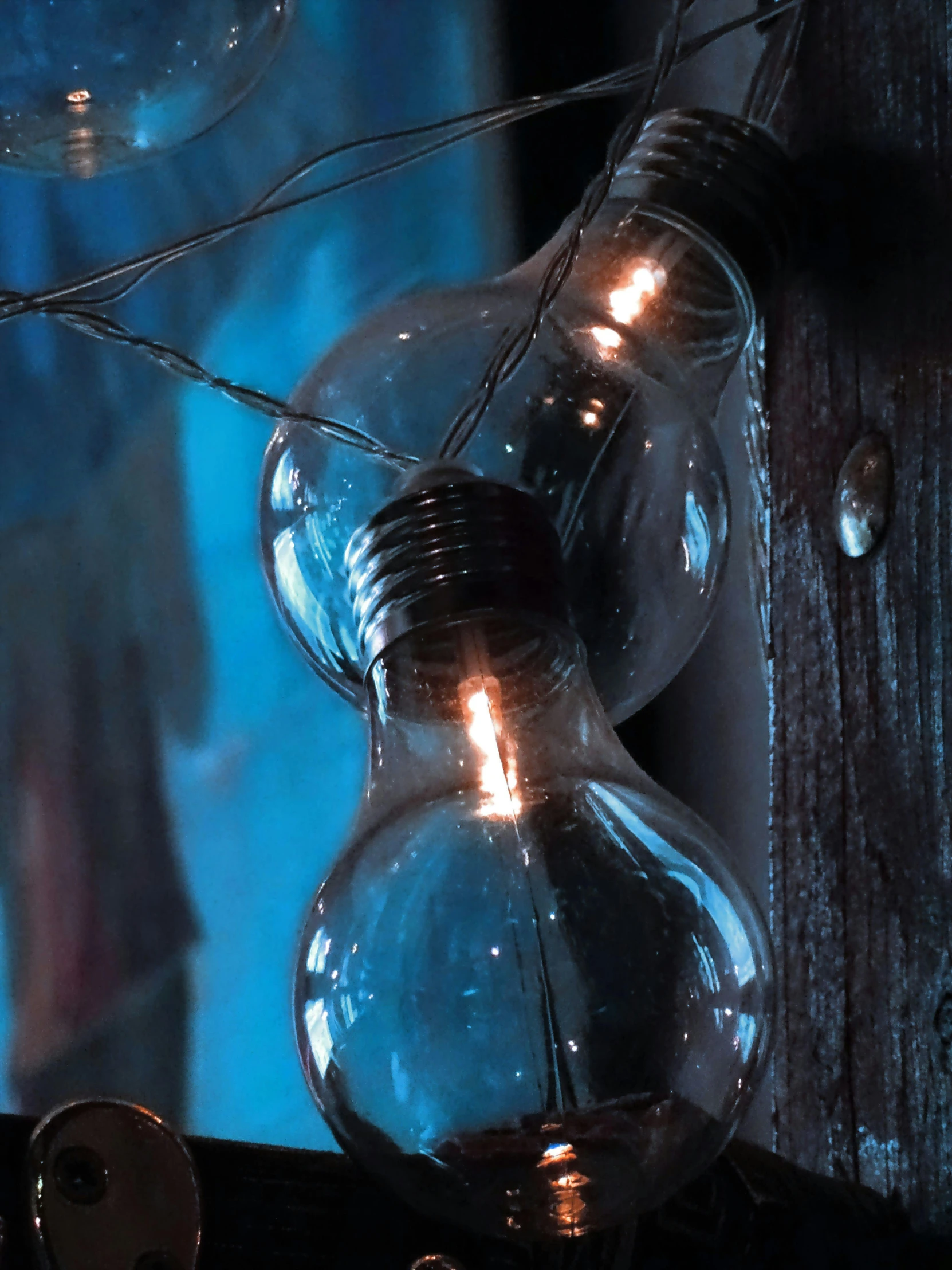 a bunch of light bulbs sitting on top of a table, inspired by Elsa Bleda, graffiti, medium closeup shot, transparent, laura watson, gothic lighting